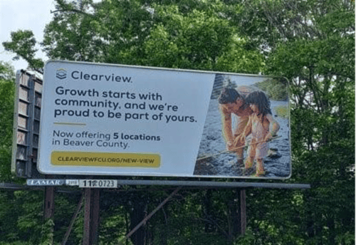 A billboard with a picture of a person and a child
AI-generated content may be incorrect.